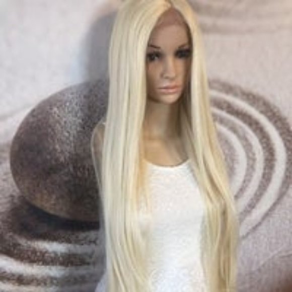 Sleek silk blonde lace wig human hair blend.